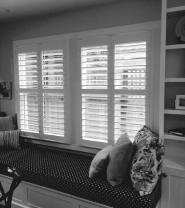shutters behind a build in couch