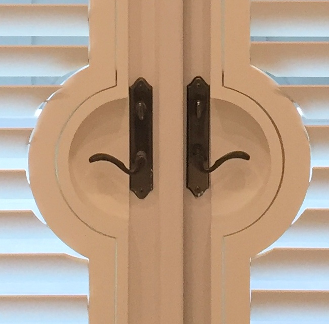 close up of shutter door handle cutouts